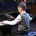 boy playing in piano recital charlotte academy of music